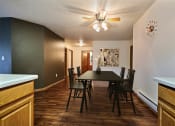 Thumbnail 6 of 31 - Fargo, ND Oxford Apartments. a dining room with a table and chairs