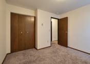 Thumbnail 18 of 28 - an empty room with two doors and a door to a closet. Fargo, Pacific Park II Apartments