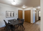 Thumbnail 2 of 16 - Fargo, ND Parkside Apartments. A dining room with a table and chairs