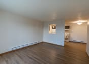 Thumbnail 5 of 16 - Fargo, ND Parkside Apartments. A living room with a hardwood floor