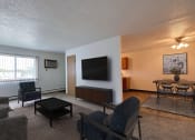 Thumbnail 2 of 23 - Living room filled with furniture and a flat screen tv at Parkwest Gardens 58078