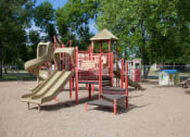Thumbnail 21 of 23 - Playground with several slides and a gazebo at Parkwest Gardens West Fargo, ND 58078