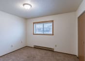 Thumbnail 6 of 10 - a bedroom of an empty house with a window. Fargo, ND Parkwood