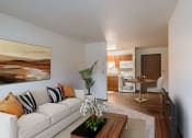 Thumbnail 1 of 10 - a living room and dining room with a couch and a table. Fargo, ND Parkwood East and West Apartments