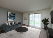 Thumbnail 4 of 15 - A living room with a couch and a coffee table. Fargo, ND Pinehurst Apartments.