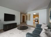 Thumbnail 5 of 15 - A living room with a couch and a coffee table. Fargo, ND Pinehurst Apartments.