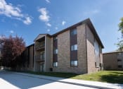 Thumbnail 36 of 36 - An exterior of a three level apartment. Fargo, ND Place One Apartments.