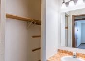 Thumbnail 13 of 14 - the bathroom has a large mirror and a sink. Fargo, ND Plumtree Apartments