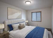 Thumbnail 2 of 32 - a bedroom with a large bed and a window. Fargo, ND Prairie Park Apartments