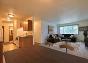 Thumbnail 5 of 20 - Fargo, ND Saddlebrook Apartments. a living room with a couch and a table