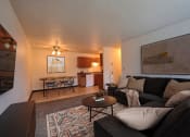 Thumbnail 4 of 20 - Fargo, ND Saddlebrook Apartments. a living room with a couch and a table