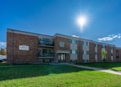 Thumbnail 20 of 20 - Fargo, ND Saddlebrook Apartments. An exterior of a three level apartment building.