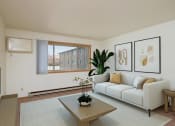 Thumbnail 1 of 22 - a living room with a couch and a coffee table. Fargo, ND Sargent Apartments