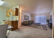 Thumbnail 3 of 17 - a living room with a couch and a coffee table. Fargo, ND Southgate Apartments