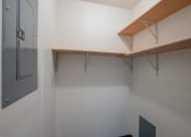 Thumbnail 21 of 25 - a room with white walls and a shelf on the wall. Fargo, ND Southview Village Apartments