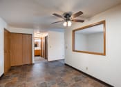 Thumbnail 19 of 25 - a dining room with a ceiling fan. Fargo, ND Southview Village Apartments