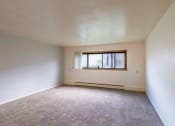 Thumbnail 5 of 14 - an empty room with a window in it. Fargo, ND Spring Apartments