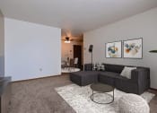 Thumbnail 1 of 10 - an empty living room with a couch and a tv. Fargo, ND Sterling Park Apartments