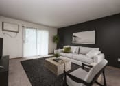 Thumbnail 1 of 43 - a living room with a white couch and a coffee table. Fargo, ND Stonebridge Apartments