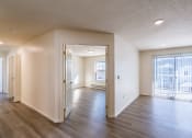 Thumbnail 24 of 43 - the living room and dining room of an empty apartment. Fargo, ND Stonebridge Apartments