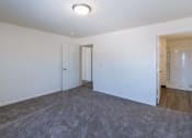 Thumbnail 32 of 43 - a bedroom with carpet and white walls. Fargo, ND Stonebridge Apartments