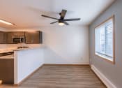 Thumbnail 17 of 20 - an empty kitchen with a ceiling fan and a window. Fargo, ND Sunwood Apartments