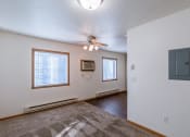 Thumbnail 11 of 20 - a studio apartment with two windows.  Fargo, ND Sunwood Apartments  | Living and kitchen Fargo, ND Sunwood Apartments