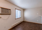 Thumbnail 12 of 20 - a dining area in a studio apartment with a window.