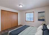 Thumbnail 3 of 20 - the second bedroom has a queen sized bed and a closet. Fargo, ND Sunwood Apartments