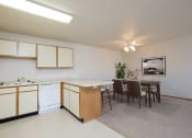 Thumbnail 3 of 28 - Fargo, ND Thunder Creek Apartments. The space features a stylish dining table, elegant chairs, and tasteful decor, providing a cozy and inviting atmosphere for enjoying meals and gatherings.