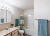 Thumbnail 27 of 28 - a bathroom with sink toilet and shower. Fargo, ND Thunder Creek Apartments