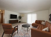 Thumbnail 1 of 16 - Fargo, ND Twin Parks Apartments. a living room with a couch coffee table and television