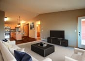 Thumbnail 4 of 45 - a living room with a couch and a tv. Fargo, ND Urban Plains Apartments
