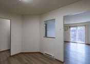 Thumbnail 19 of 26 - a dining room with a living room in the background. Fargo, ND Village West Apartment