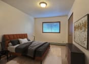 Thumbnail 3 of 11 - Fargo, ND Westcourt Apartments. bedroom with a bed and a window