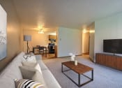 Thumbnail 1 of 11 - Fargo, ND Westcourt Apartments.  a living room with a couch and a coffee table