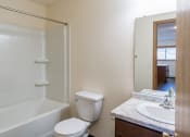 Thumbnail 38 of 42 - a bathroom with a sink and a toilet and a shower. Fargo, ND Westwood Apartments