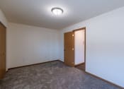 Thumbnail 40 of 42 - a bedroom with a closet. Fargo, ND Westwood Apartments