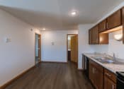 Thumbnail 37 of 42 - a dining room with a door to a bedroom and bathroom in the background. Fargo, ND Westwood Apartments
