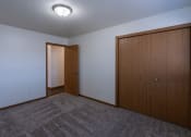 Thumbnail 28 of 42 - a bedroom with a closet. Fargo, ND Westwood Apartments