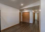 Thumbnail 26 of 42 - a dining room with a closet and the entry door with a hallway. Fargo, ND Westwood Apartments
