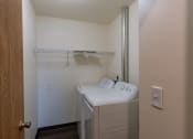 Thumbnail 31 of 42 - a laundry room with a washer and dryer. Fargo, ND Westwood Apartments