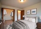 Thumbnail 4 of 42 - a bedroom with a bed and two night stands. Fargo, ND Westwood Estates Apartments