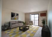 Thumbnail 1 of 42 - a living room with a yellow and gray rug. Fargo, ND Westwood Estates Apartments