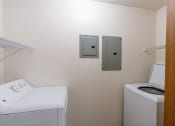 Thumbnail 11 of 24 - a laundry room with a washer and dryer. Fargo, ND Willow Park Apartments