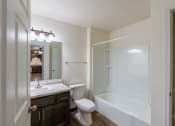 Thumbnail 17 of 24 - a bathroom with a sink and a toilet and a shower. Fargo, ND Willow Park Apartments