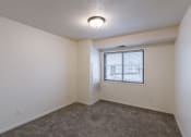 Thumbnail 15 of 24 - a bedroom with a window. Fargo, ND Willow Park Apartments