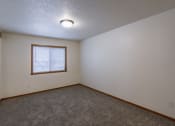 Thumbnail 20 of 24 - a bedroom with a window. Fargo, ND Willow Park Apartments