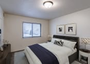 Thumbnail 6 of 24 - an empty bedroom with a bed and a window. Fargo, ND Willow Park Apartments