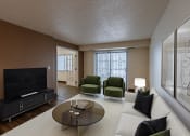Thumbnail 4 of 24 - a living room with a couch and a coffee table and a television. Fargo, ND Willow Park Apartments